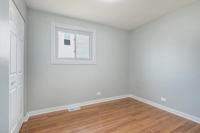 empty room with light hardwood / wood-style floors