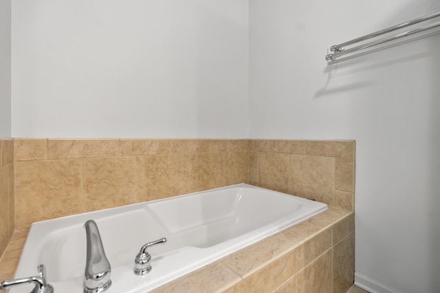 bathroom featuring a relaxing tiled tub