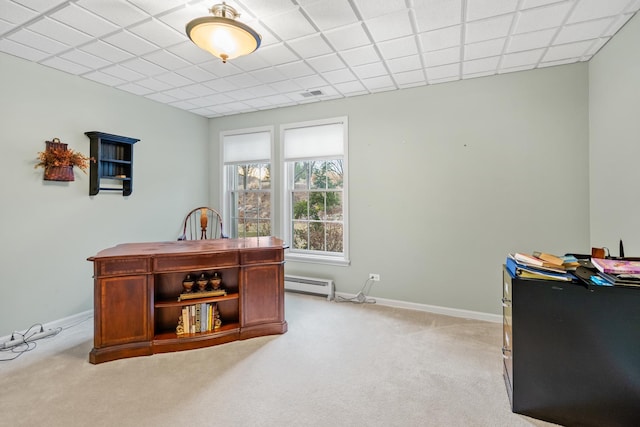 carpeted home office featuring baseboard heating and a paneled ceiling