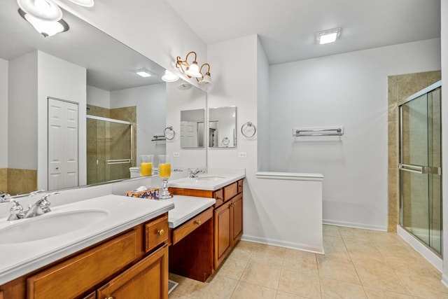 bathroom featuring an enclosed shower, vanity, and tile patterned floors