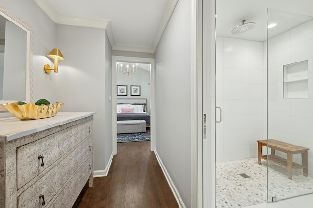 hall with ornamental molding and dark wood-type flooring