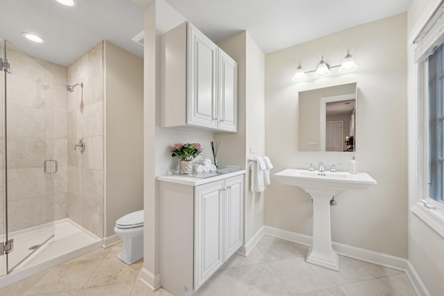 bathroom featuring a shower with shower door, tile patterned floors, and toilet