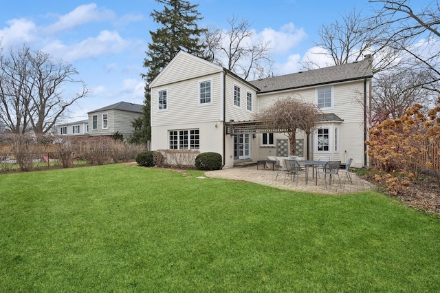 back of property featuring a pergola, a lawn, and a patio