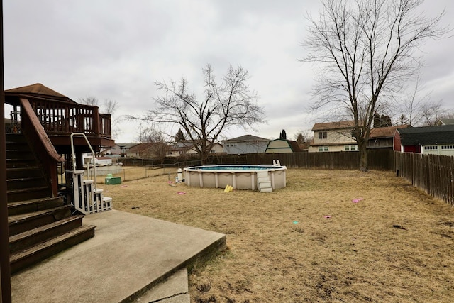 view of yard with a fenced in pool and a patio