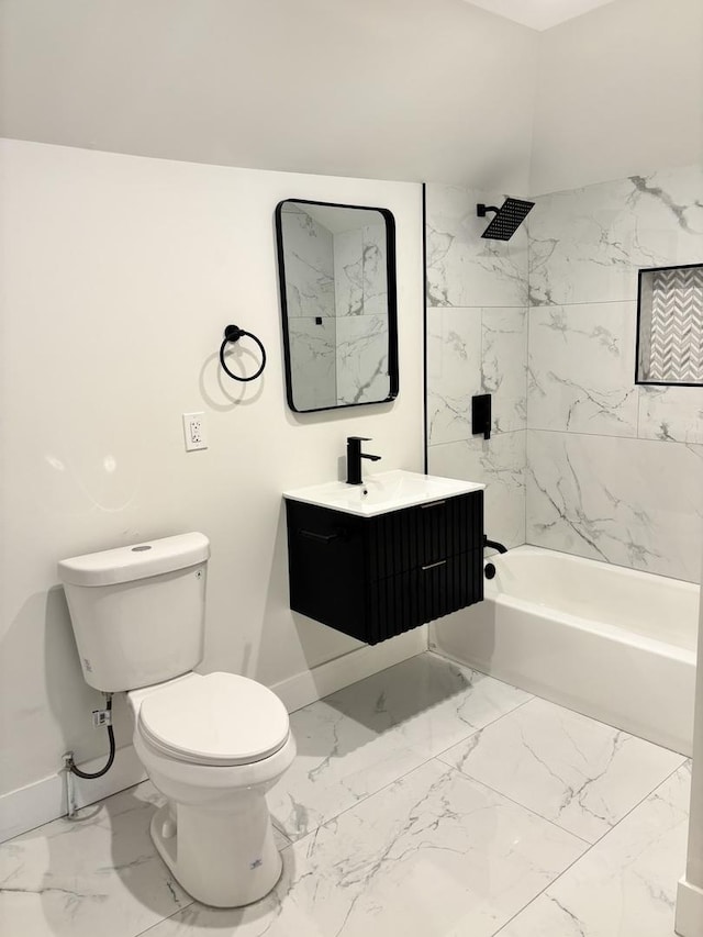 full bathroom with tiled shower / bath, vanity, and toilet