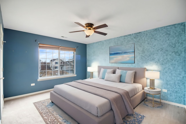 bedroom with ceiling fan and carpet floors