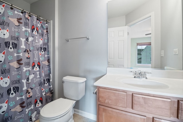 bathroom featuring a shower with curtain, vanity, tile patterned floors, and toilet