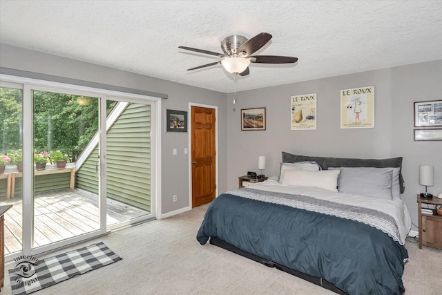 bedroom with a textured ceiling, ceiling fan, light colored carpet, baseboards, and access to exterior