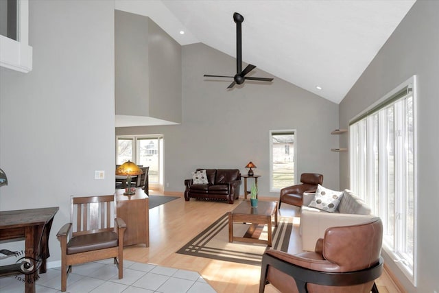 living area featuring high vaulted ceiling, recessed lighting, ceiling fan, and light wood-style flooring