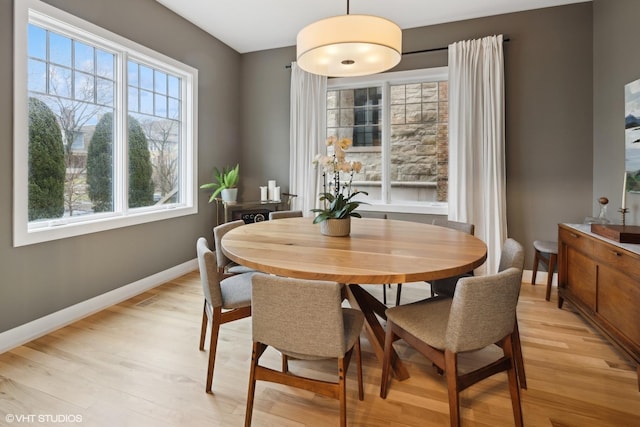 dining space featuring light hardwood / wood-style floors