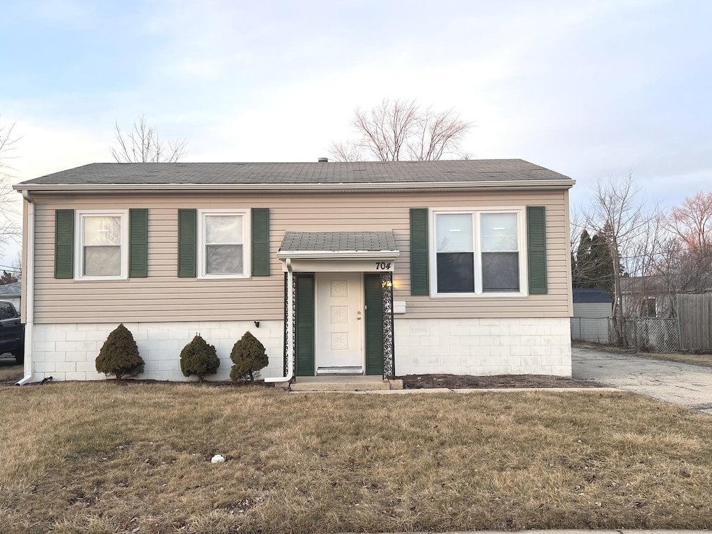 bi-level home with a front yard