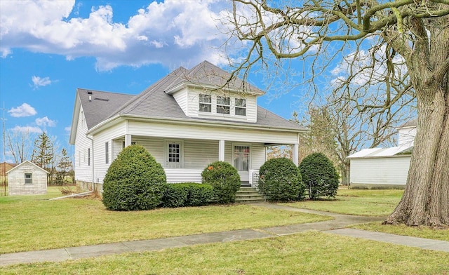 view of front of home featuring a porch and a front yard