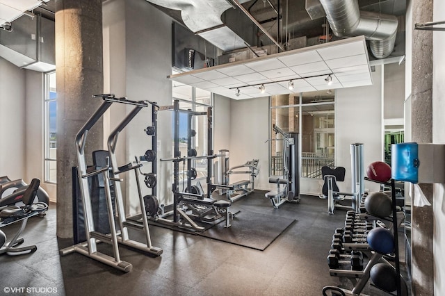 exercise room featuring track lighting