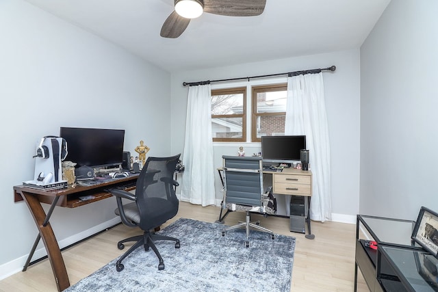 home office featuring ceiling fan and light hardwood / wood-style flooring