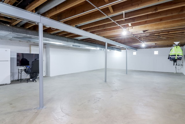 basement with white fridge