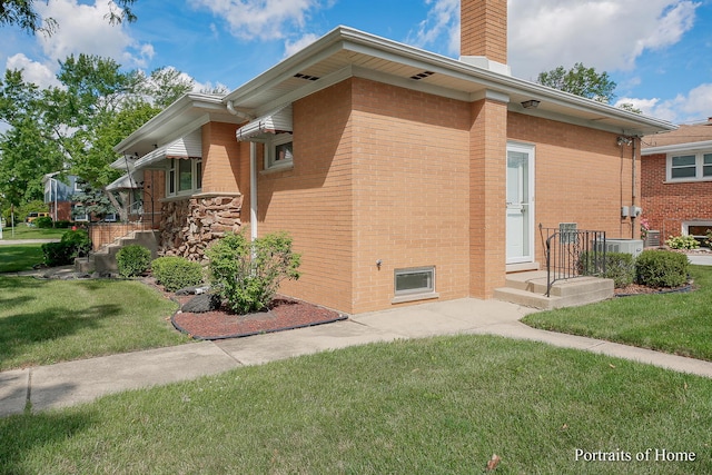 view of property exterior with a lawn