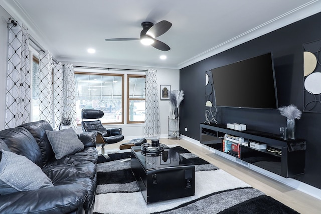 living room featuring ornamental molding, wood-type flooring, and ceiling fan