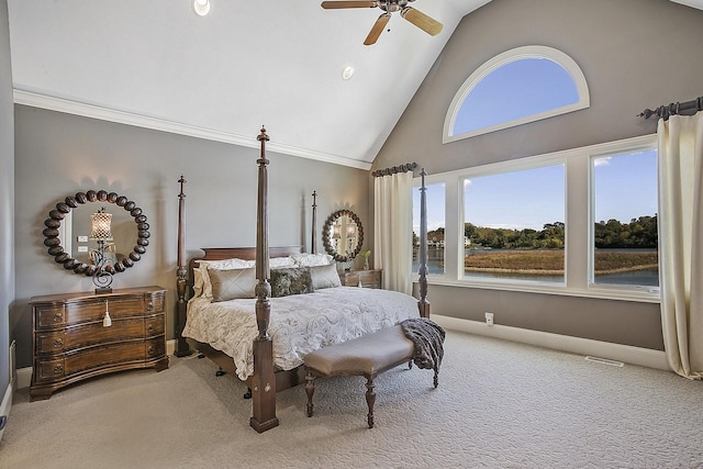 carpeted bedroom with crown molding, high vaulted ceiling, and ceiling fan