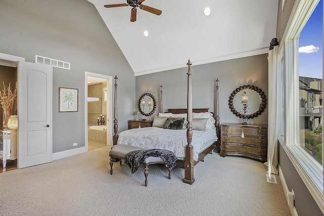 carpeted bedroom featuring connected bathroom, ornamental molding, high vaulted ceiling, and ceiling fan