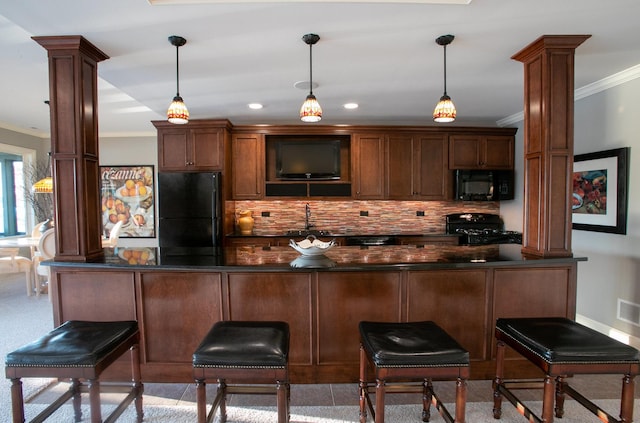 bar with decorative light fixtures, decorative columns, sink, ornamental molding, and black appliances