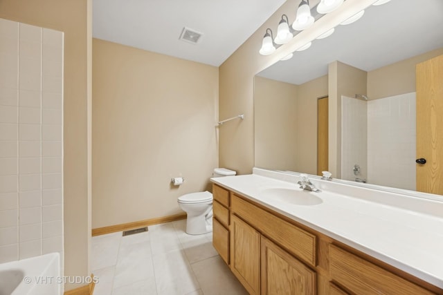 bathroom with tile patterned flooring, vanity, and toilet