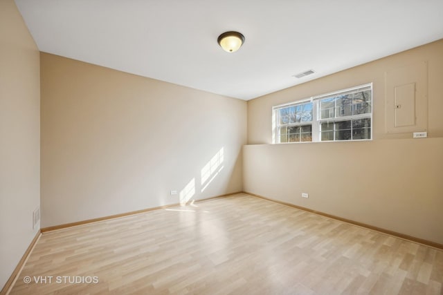 unfurnished room featuring light wood-type flooring