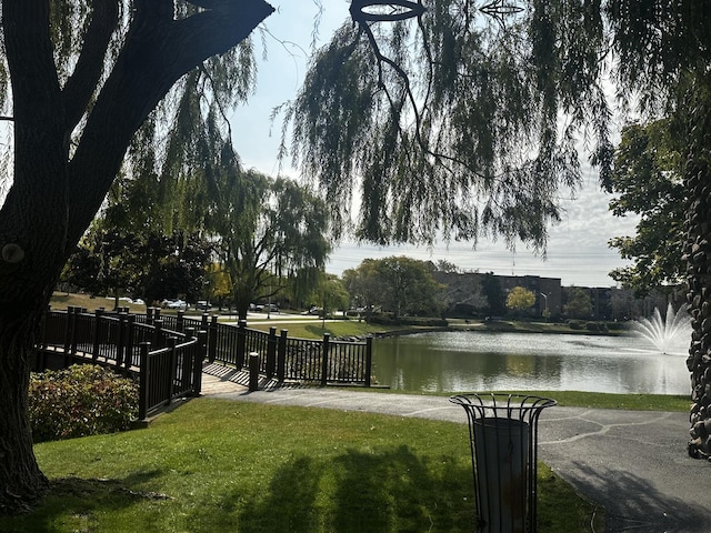 500 W Huntington Commons Rd Unit 152, Mount Prospect, IL 60056 - water view featuring fence
