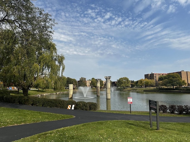 500 W Huntington Commons Rd Unit 152, Mount Prospect, IL 60056 - view of home's community with a water view and a yard