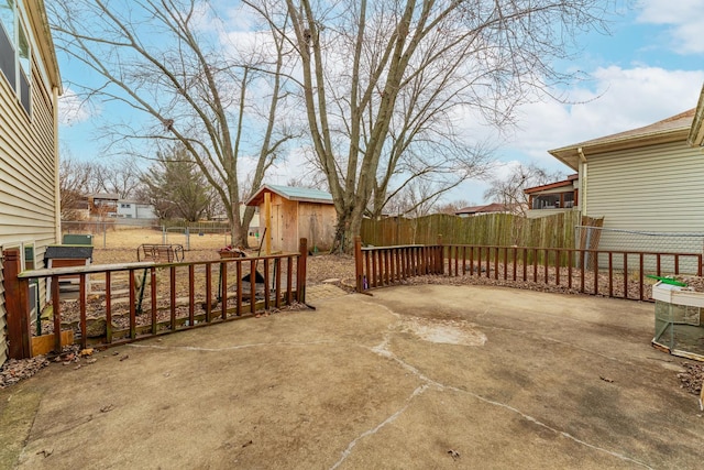 view of patio / terrace featuring a storage unit