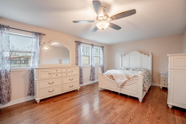 bedroom featuring ceiling fan and light hardwood / wood-style flooring