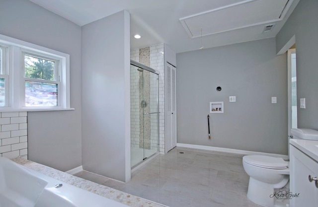 bathroom featuring vanity, toilet, baseboards, and a stall shower