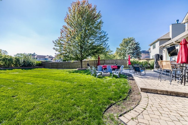 view of yard featuring an outdoor fire pit and a patio