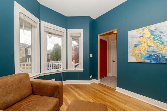 living area with hardwood / wood-style floors