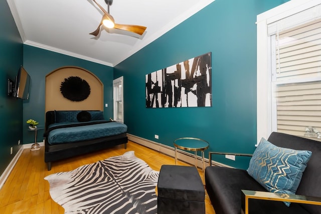 living area with crown molding, ceiling fan, and wood-type flooring