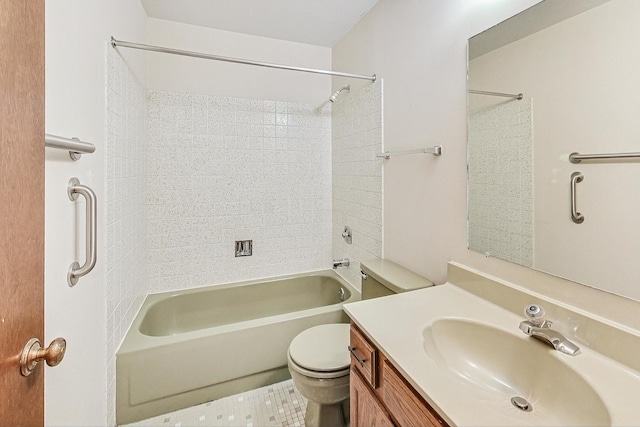 full bathroom with tile patterned flooring, tiled shower / bath, vanity, and toilet