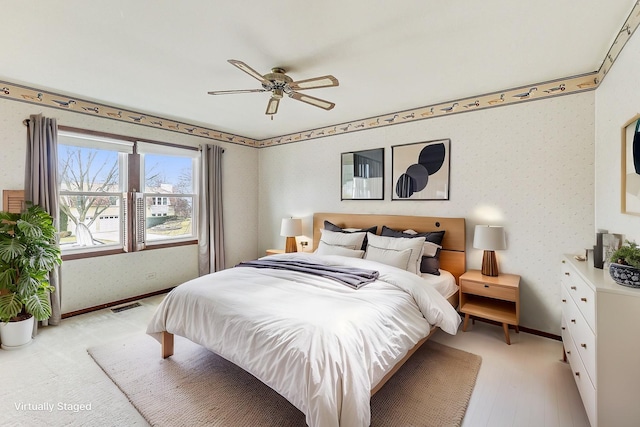 bedroom featuring ceiling fan and light hardwood / wood-style floors