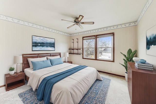 bedroom featuring ceiling fan and light colored carpet