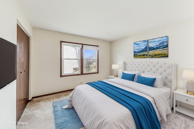 bedroom featuring light carpet