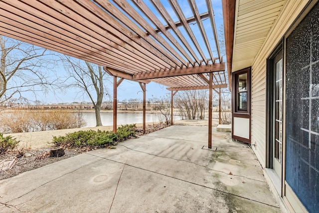 view of patio / terrace with a water view and a pergola