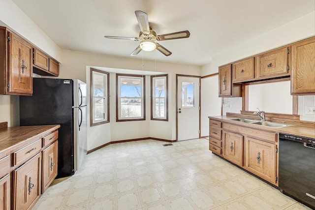 kitchen with ceiling fan, stainless steel fridge, dishwasher, and sink