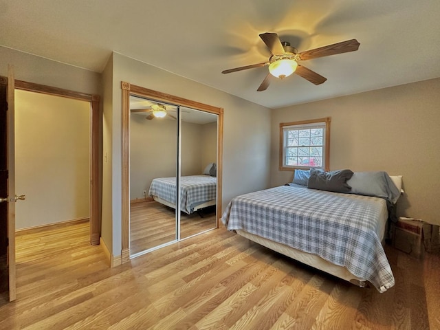 bedroom featuring a closet, ceiling fan, and light hardwood / wood-style flooring