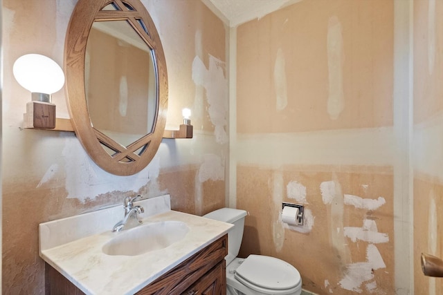 bathroom featuring toilet and vanity