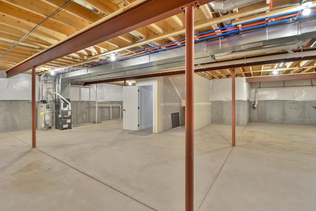 basement with heating unit and water heater