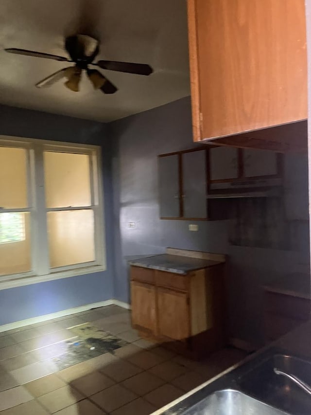 kitchen with tile patterned floors and ceiling fan