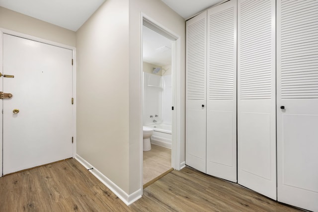 corridor featuring light hardwood / wood-style floors