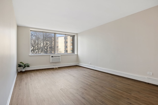 empty room with hardwood / wood-style flooring and a wall mounted AC