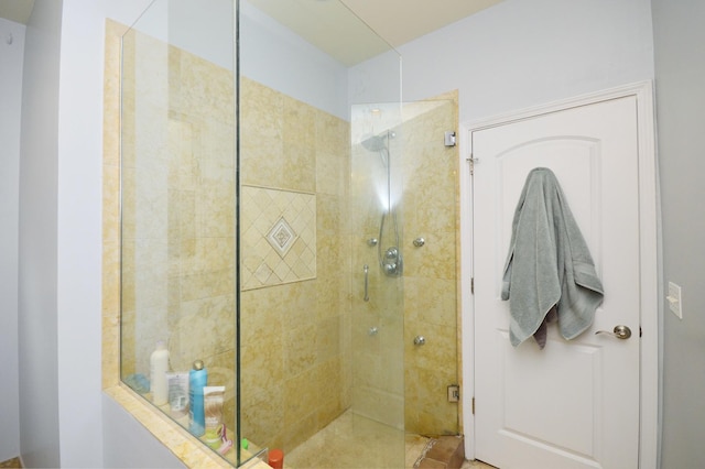 bathroom with a shower with shower door