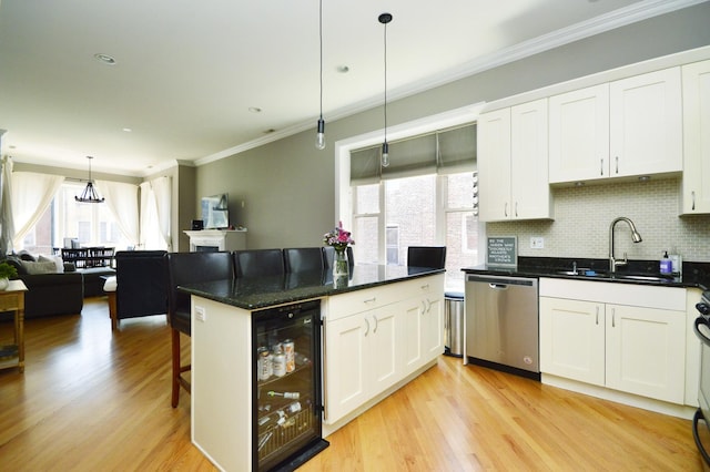 kitchen featuring wine cooler, white cabinetry, decorative light fixtures, and dishwasher