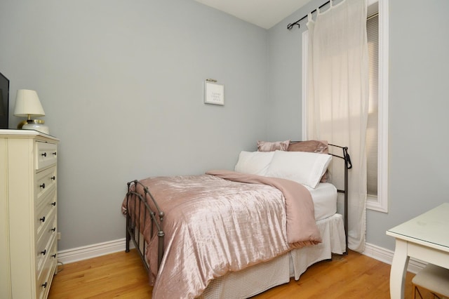 bedroom with light hardwood / wood-style flooring