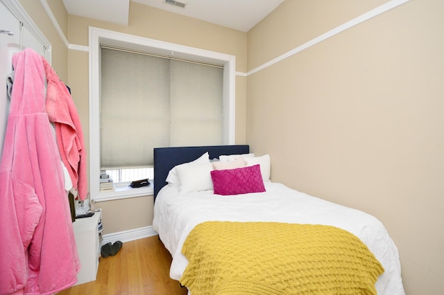 bedroom featuring wood-type flooring